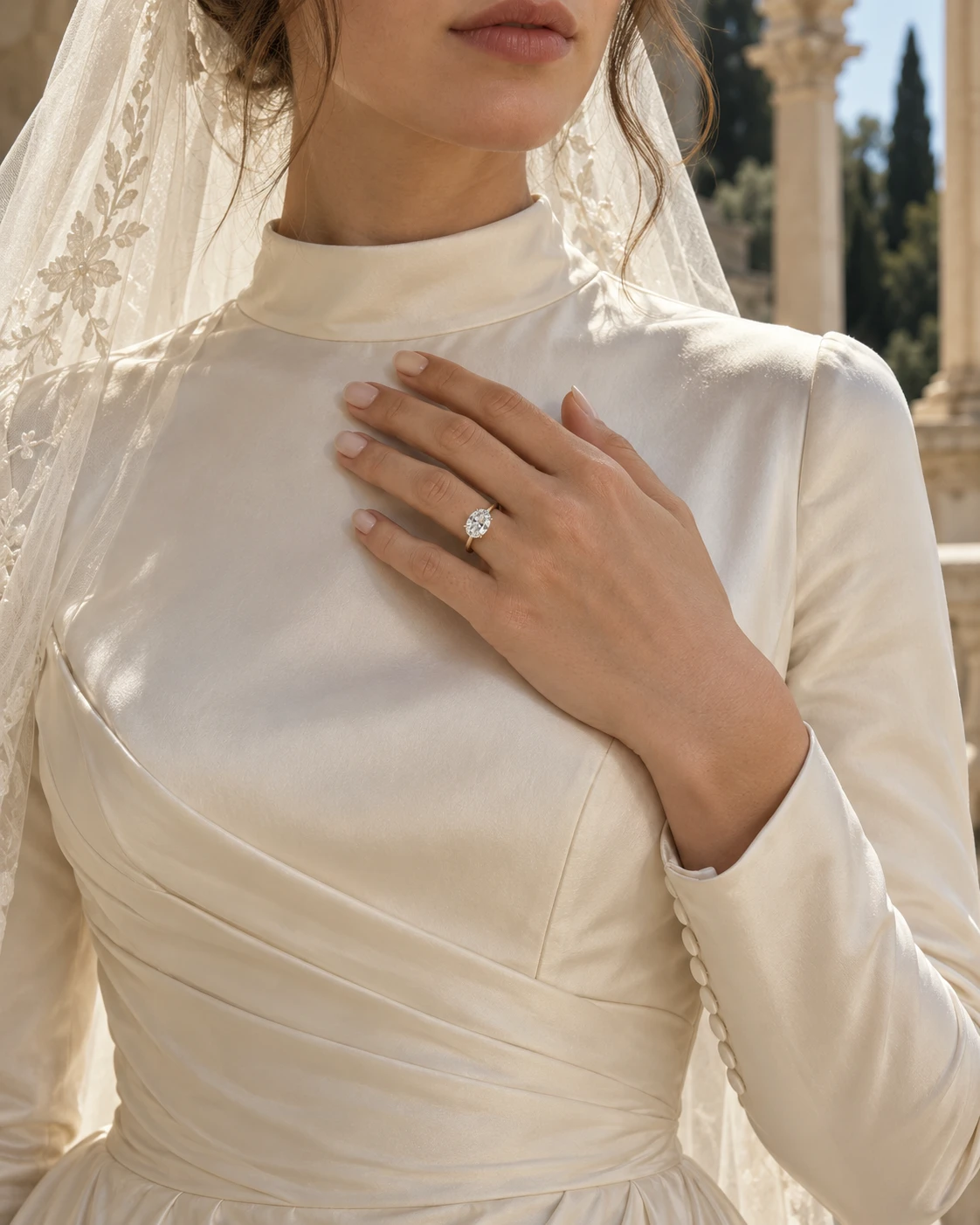 A bride wearing an oval solitaire engagement ring